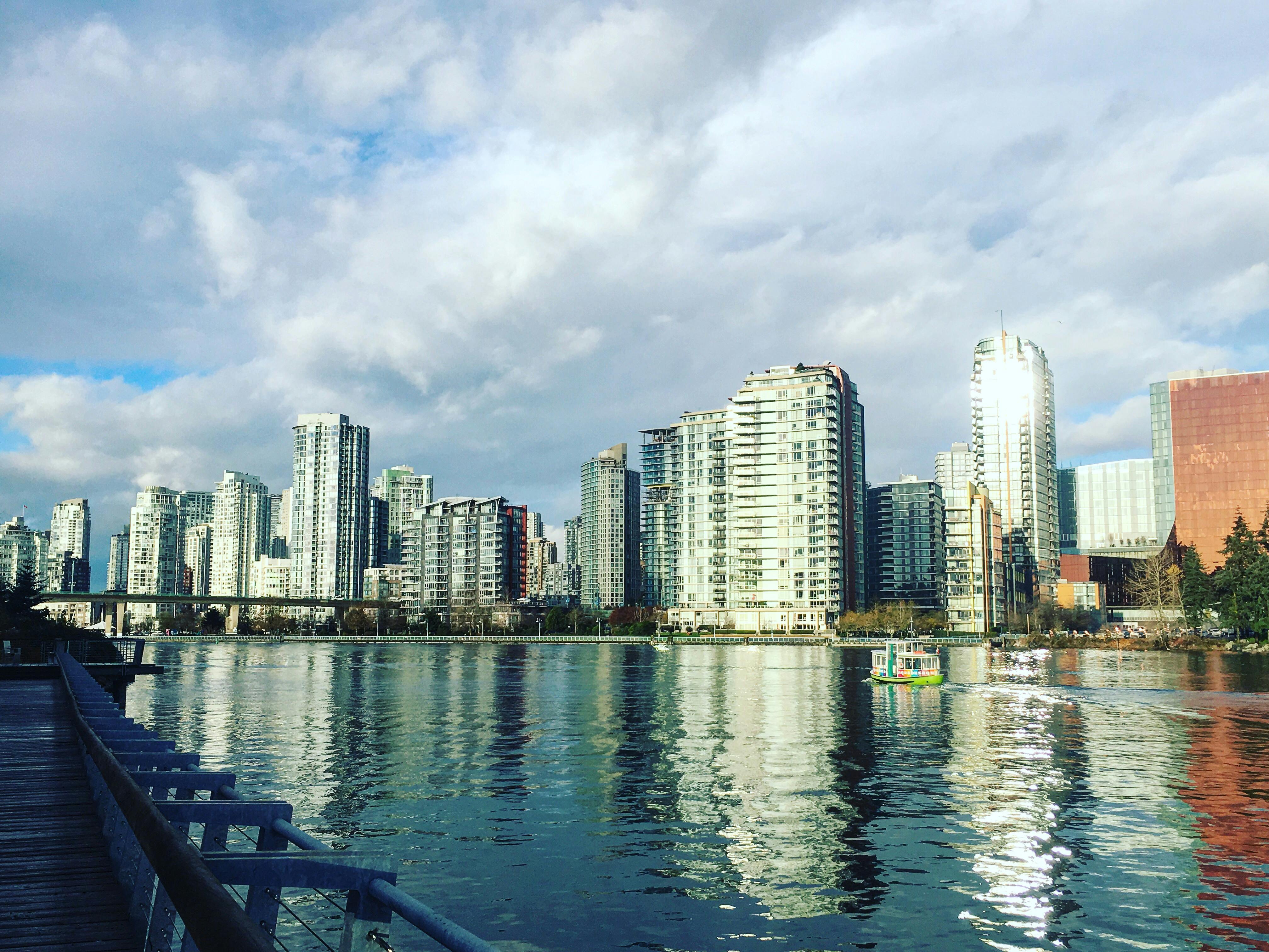 Sunny day in Olympic Village during a 2018 winter king tide. The water levels are very high and there isn't a lot of freeboard along the coastline.