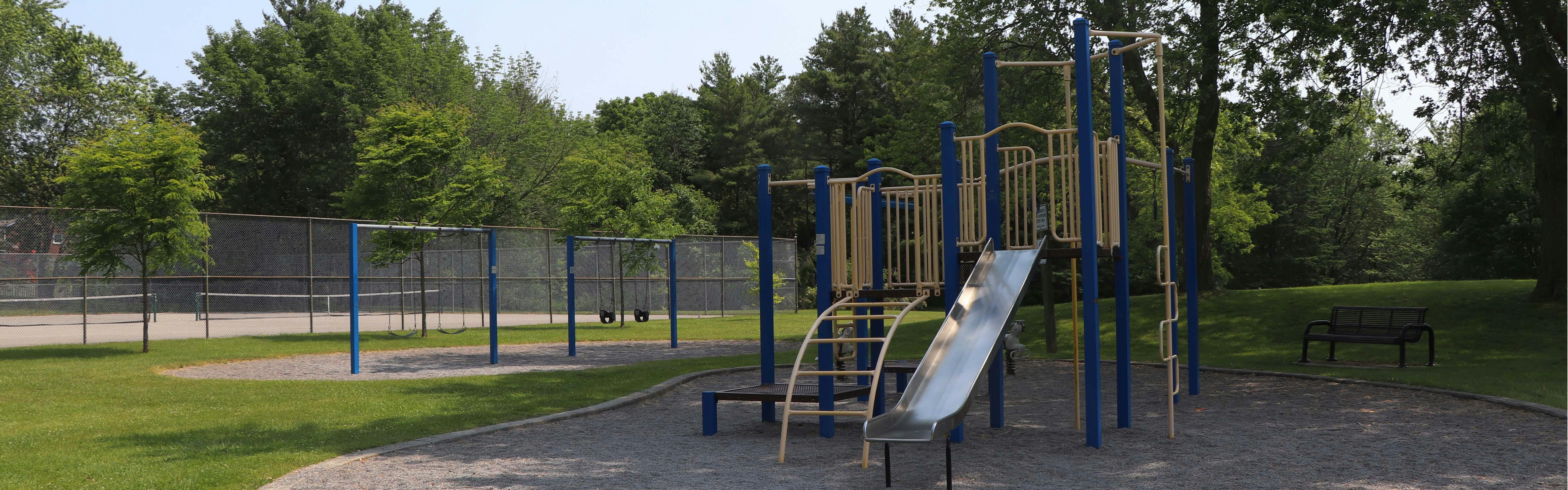 Playground structure and tennis courts at D'Hillier Park