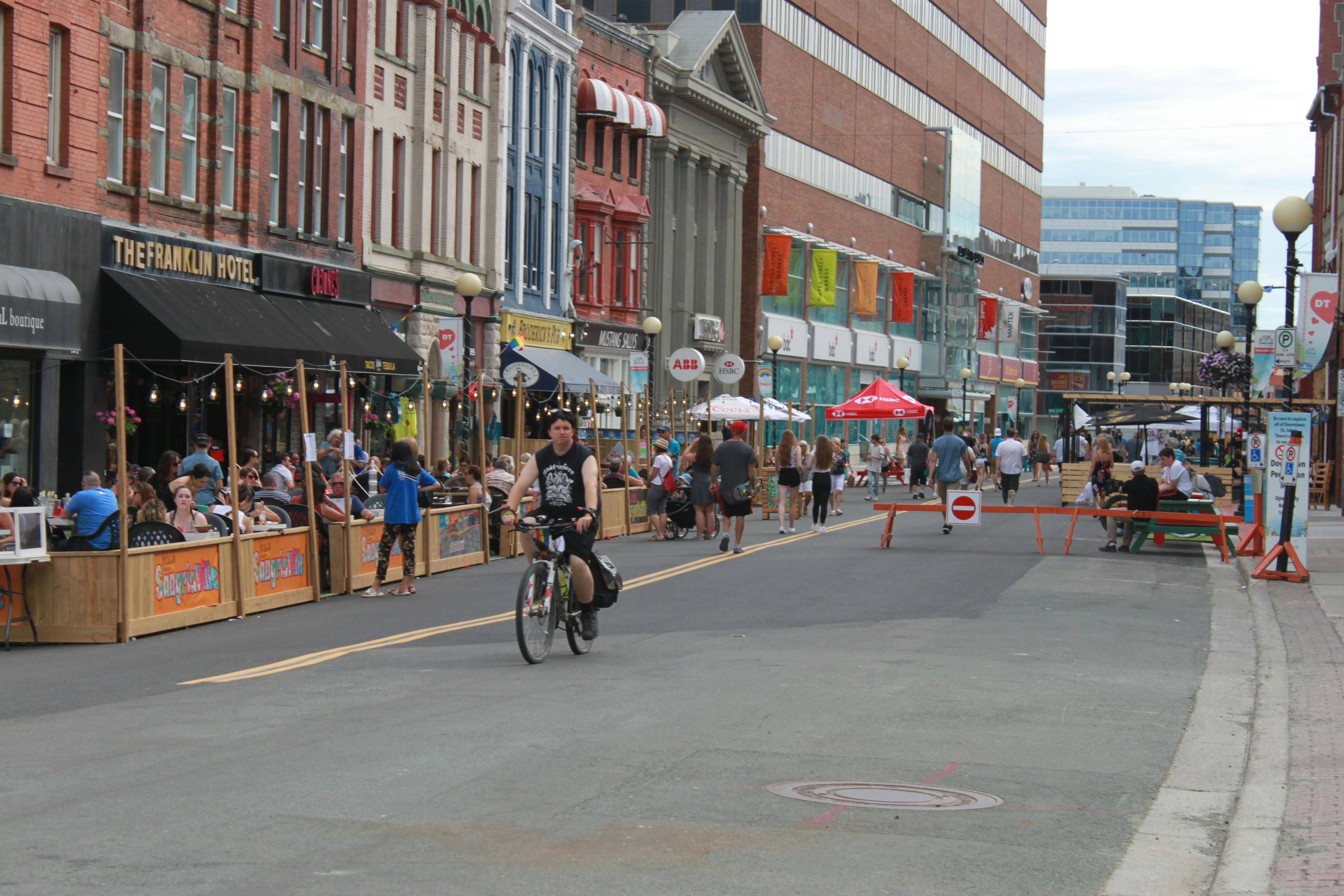 PIC_Water Street Pedestrian Mall_pedestrians restaurant patrons bicyclist.jpg