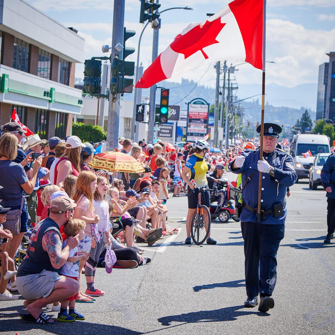 Image of Canada Day Parade marshall with a canada flag