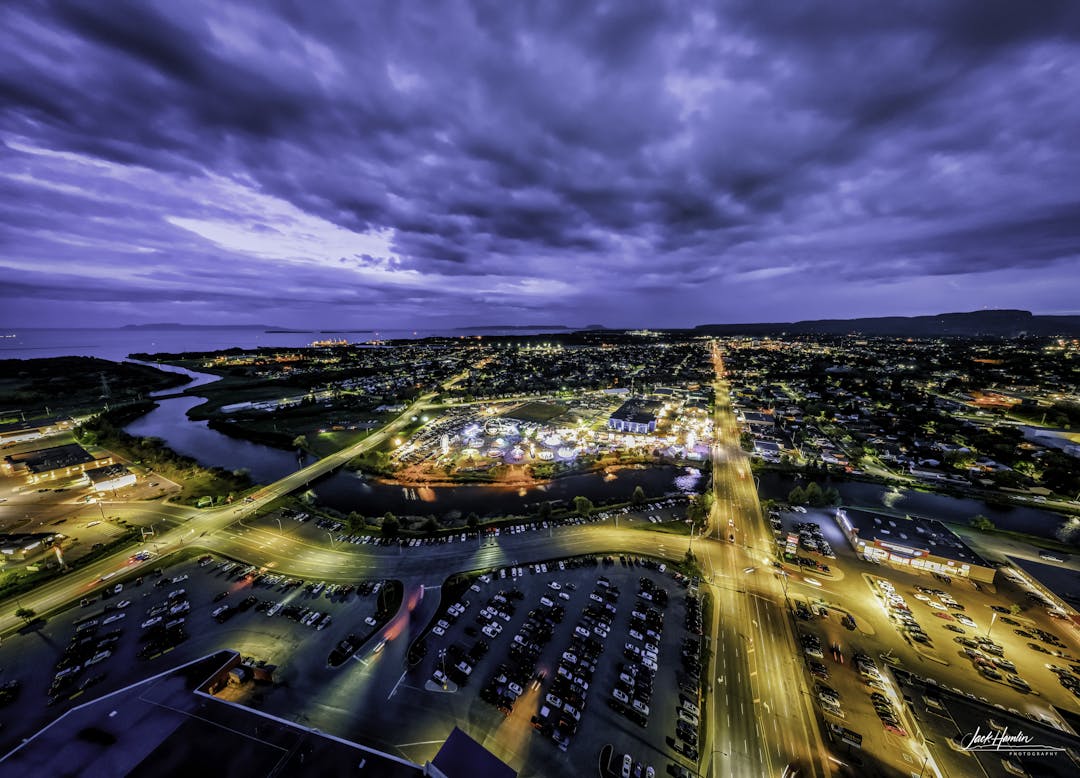 A long-exposure photograph shows Thunder Bay at dusk from an aerial perspective looking south from the Intercity area.