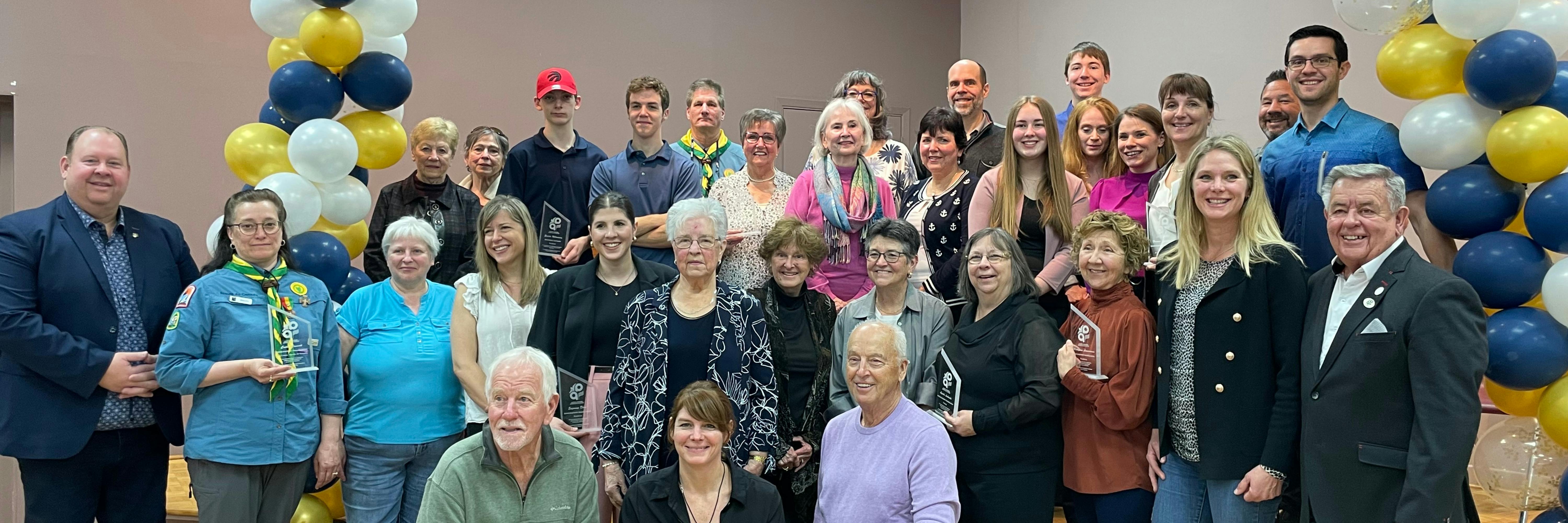 Recognized volunteers posing for the photo.