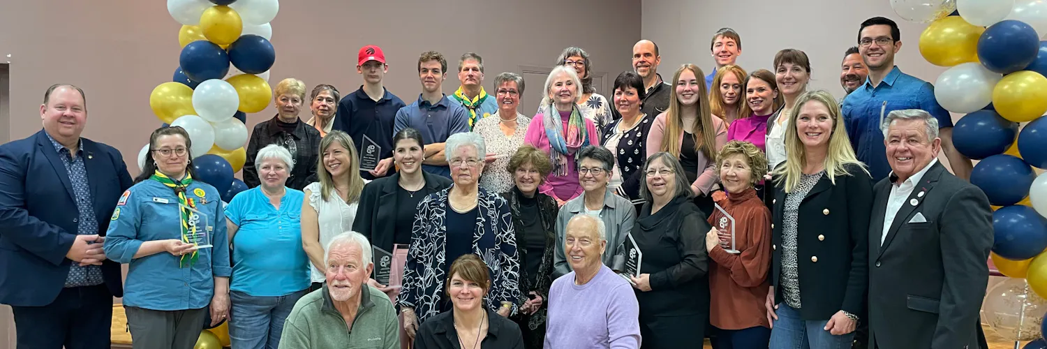 Recognized volunteers posing for the photo.