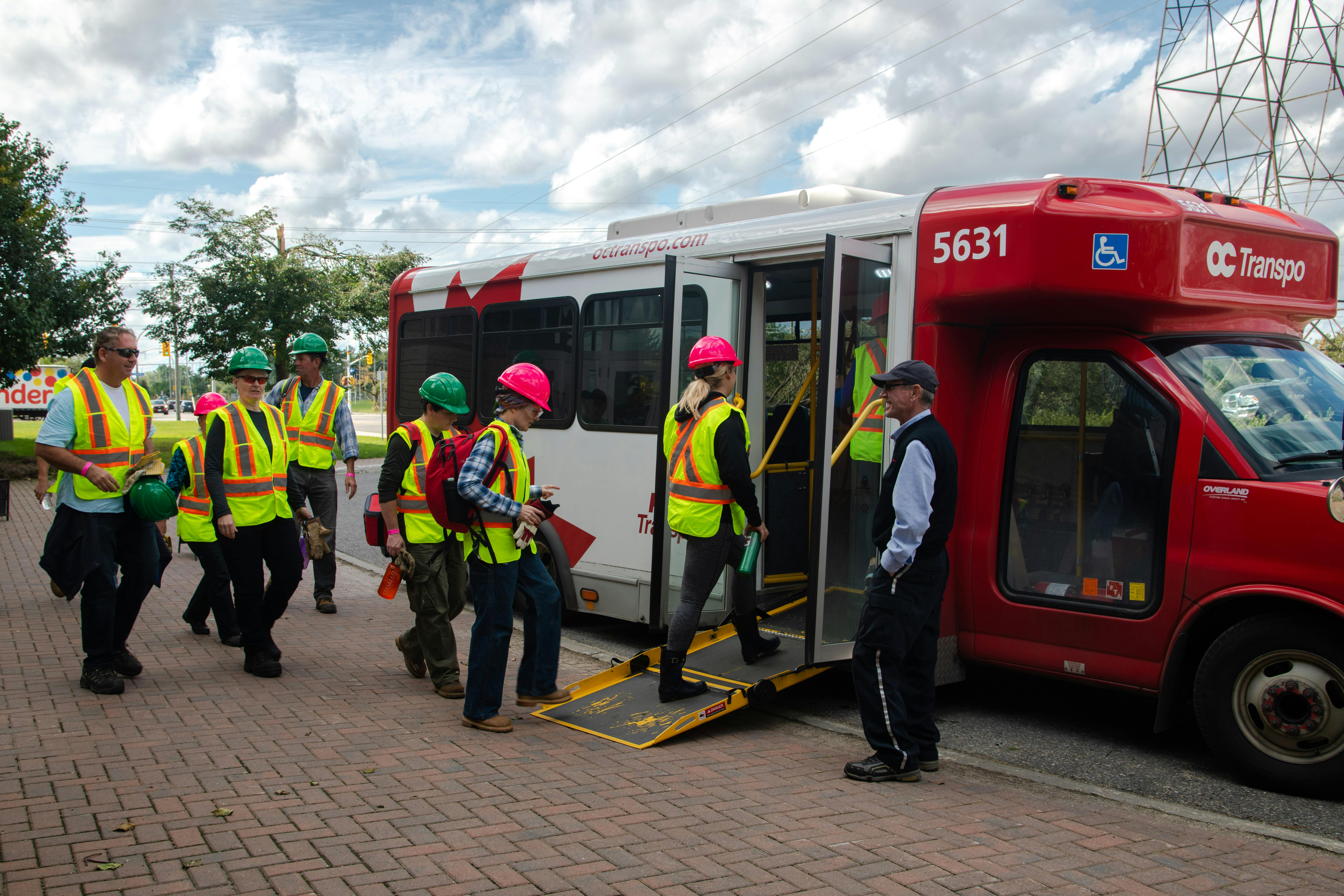 volunteers board the shuttle bus