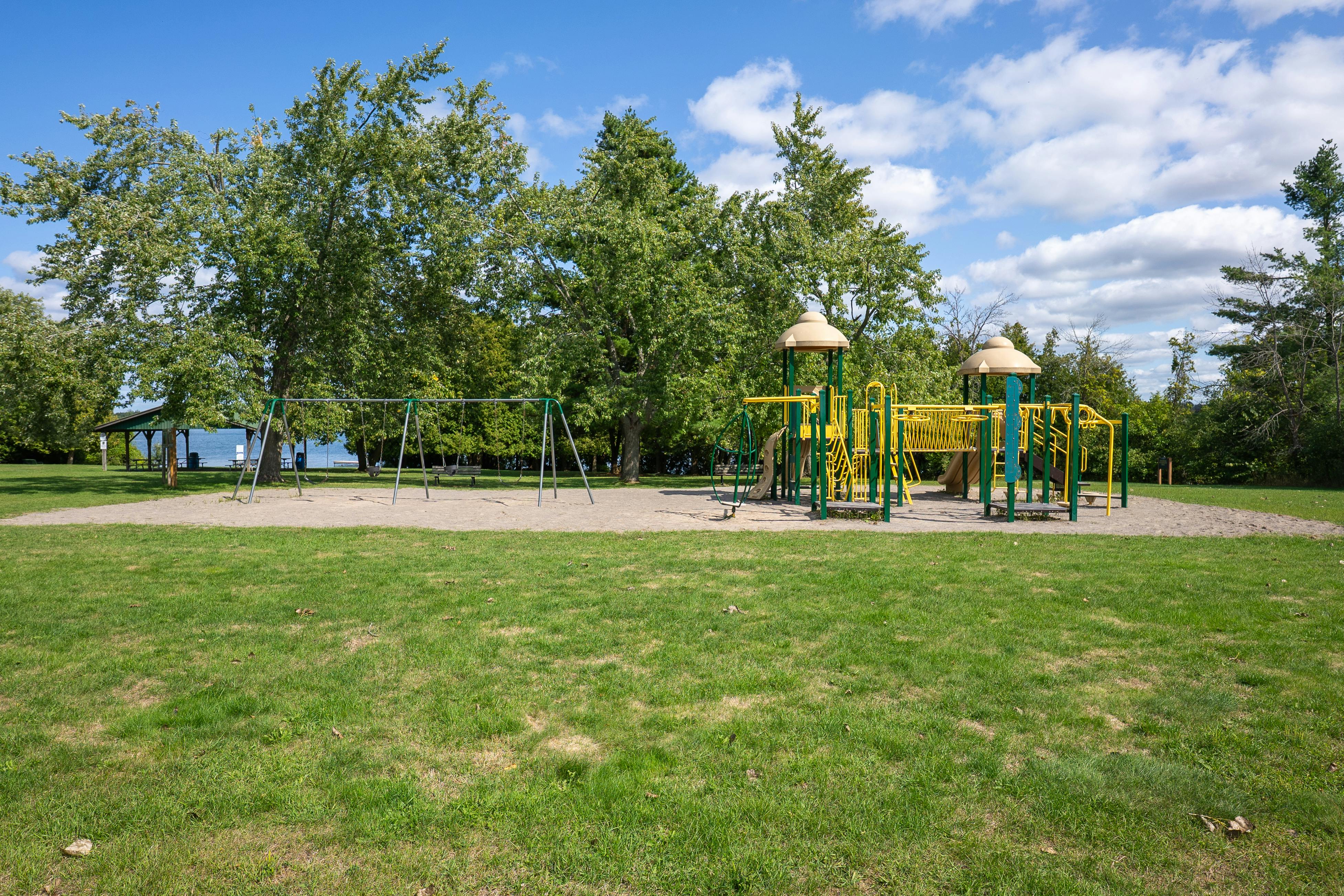 Photo of existing playground and swing set at the Ennismore Waterfront Park and Beach