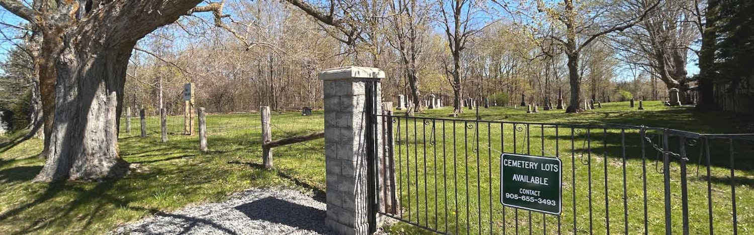 View of the cemetery from the outside of the fence looking in.