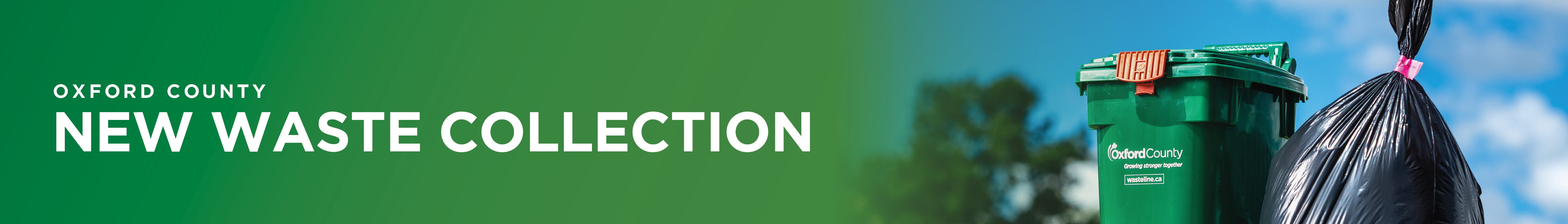 A curb with garbage bag, green bin and blue boxes