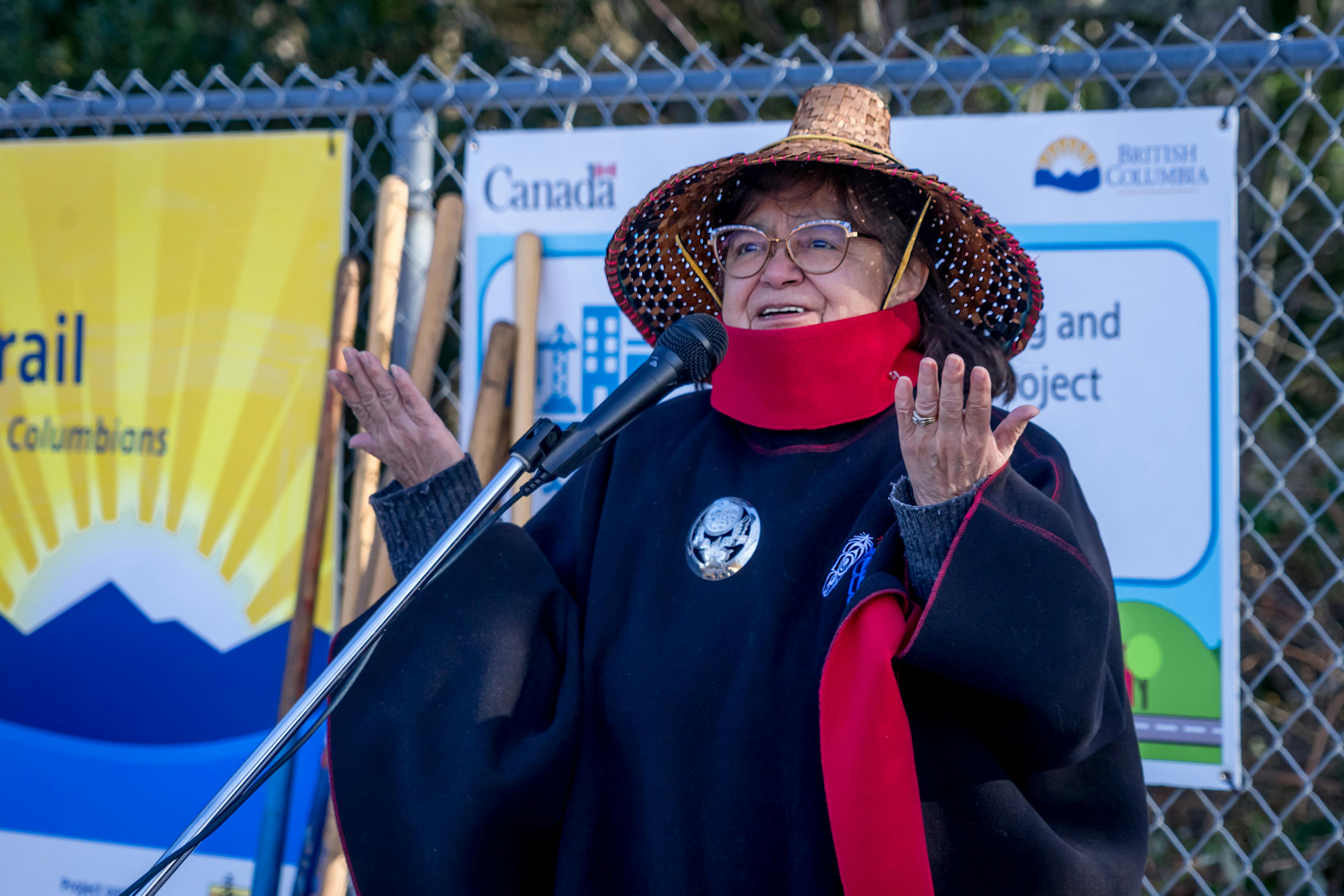 Elder Jackie raises her hands in support of the project.jpg