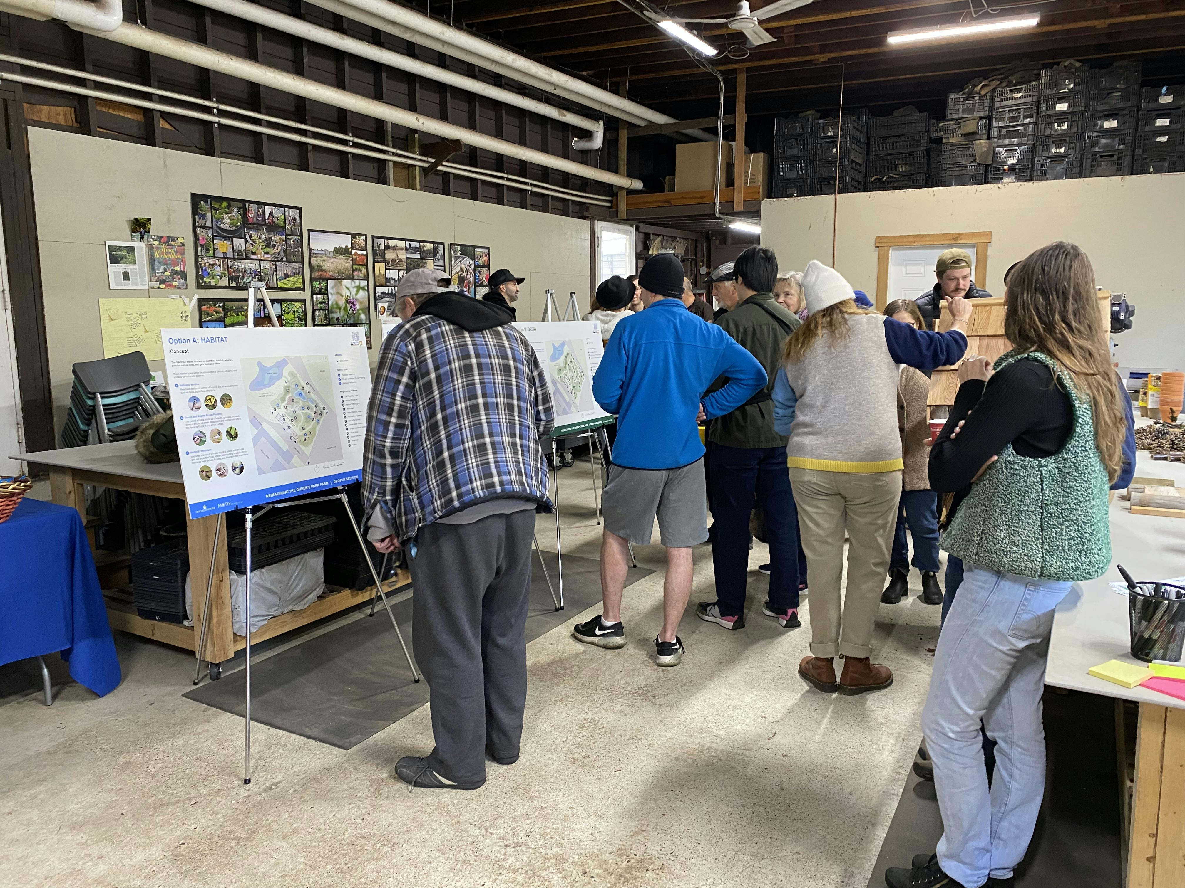 Participants read information and help build an insect hotel at the Nov. 19 drop-in engagement at the Queen's Park Greenhouse