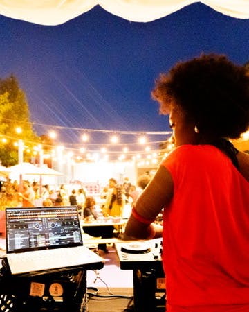 DJ playing at Chess Hive Pop-up.
