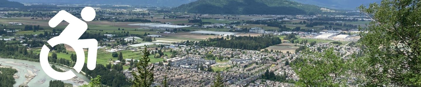 Aerial image of Chilliwack with Vedder River. A white access icon over top of the image on the left.