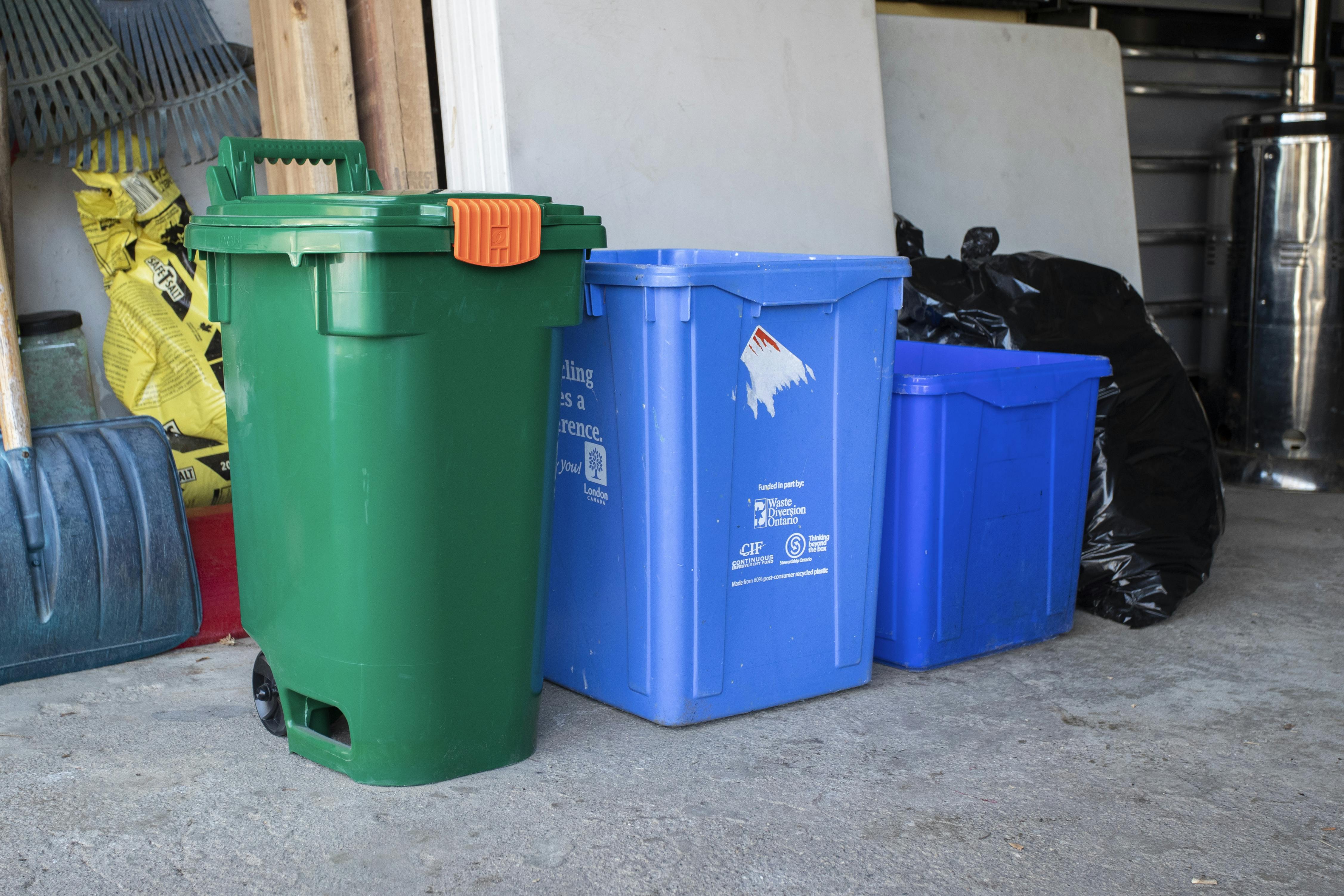 A small size Green Bin in a garage