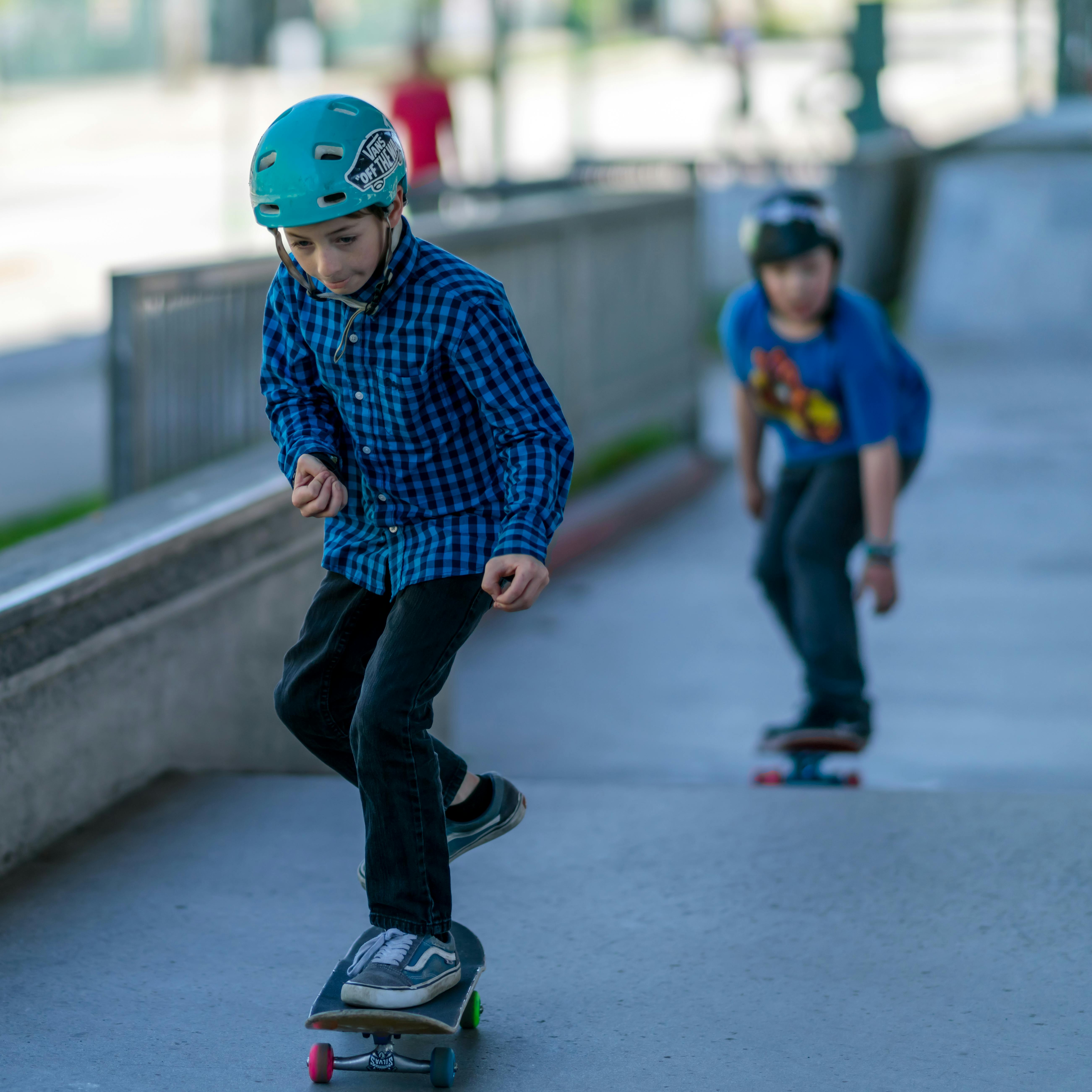 Two young boys skateboarding at Plaza