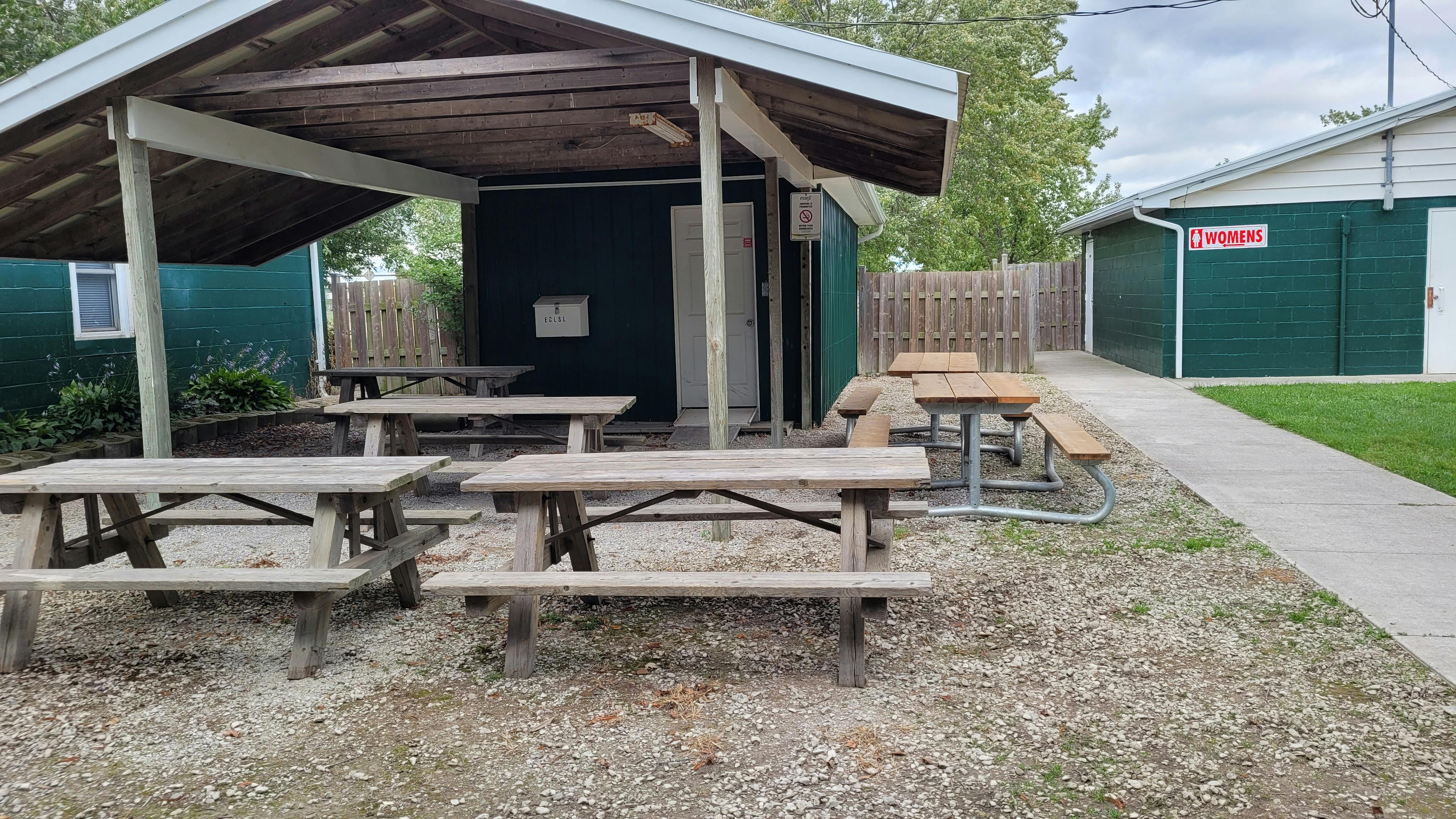 Existing small building and shelter with picnic tables