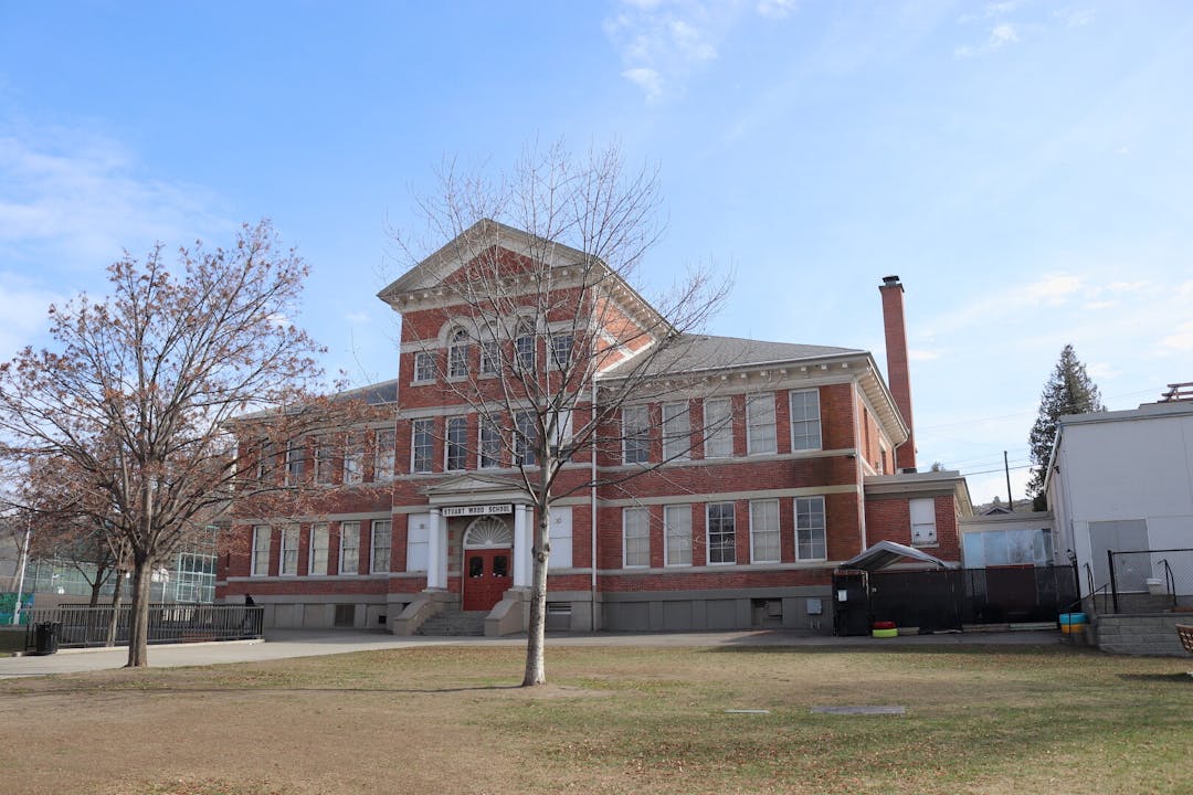 An illustration of a brick building with a sign that says "shelter."