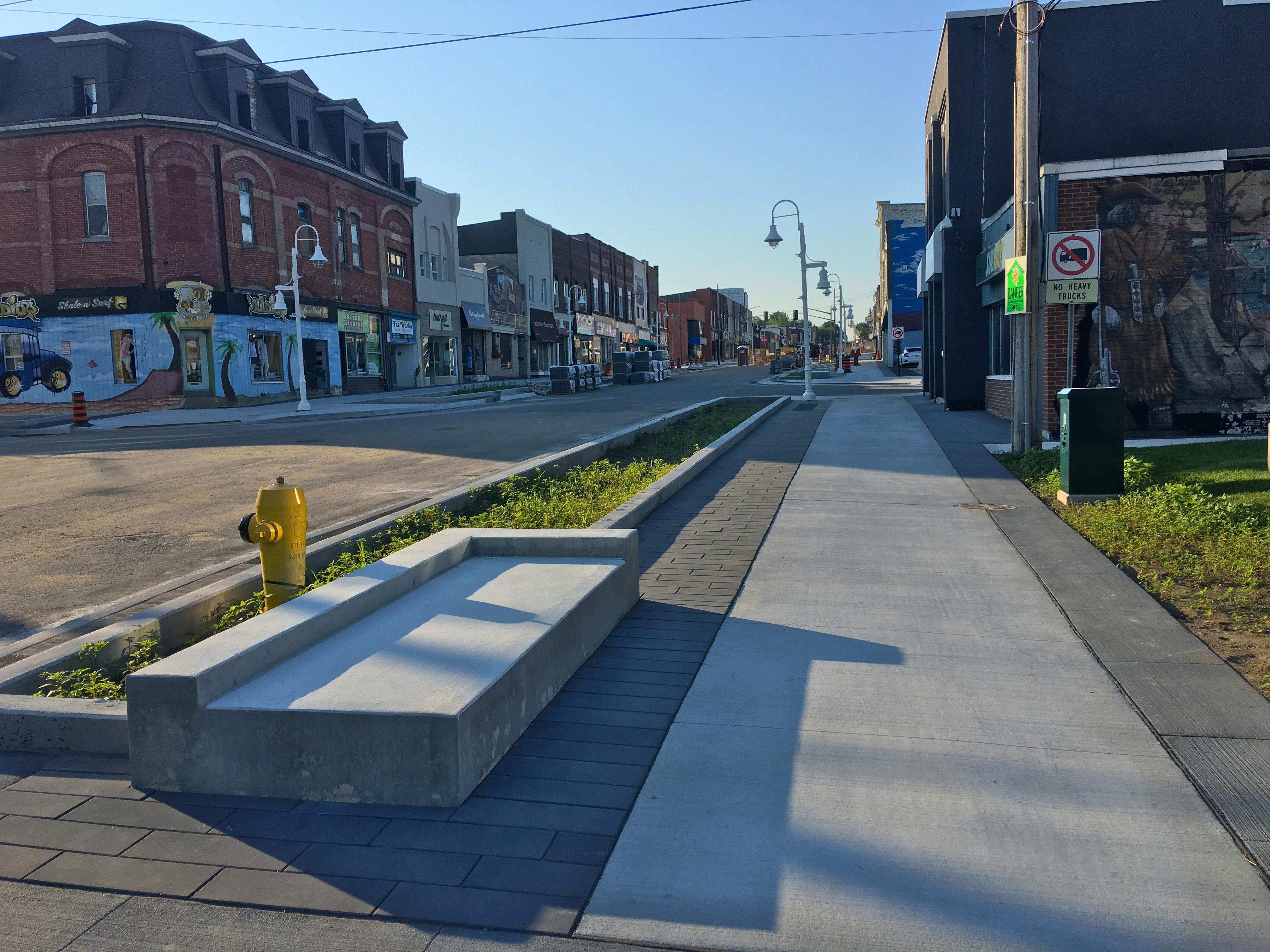 Completed bench, garden planter, sidewalk