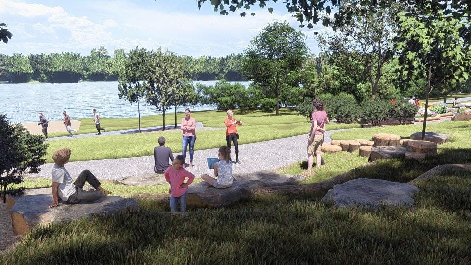 The amphitheater area can be a community space for gathering, learning, fitness, or views over the lake.