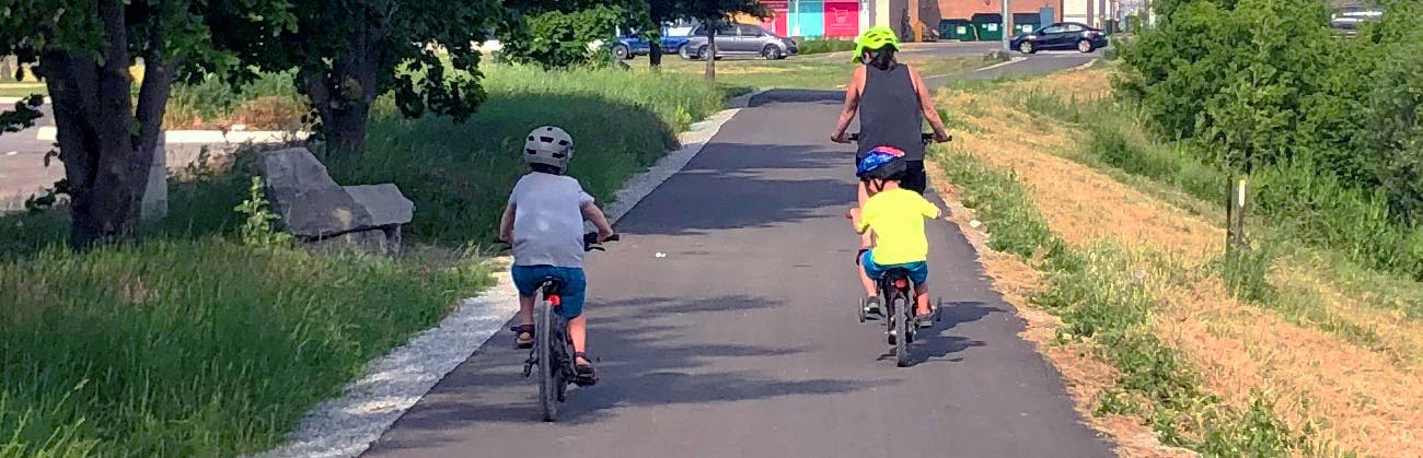 Family biking on the bike trail