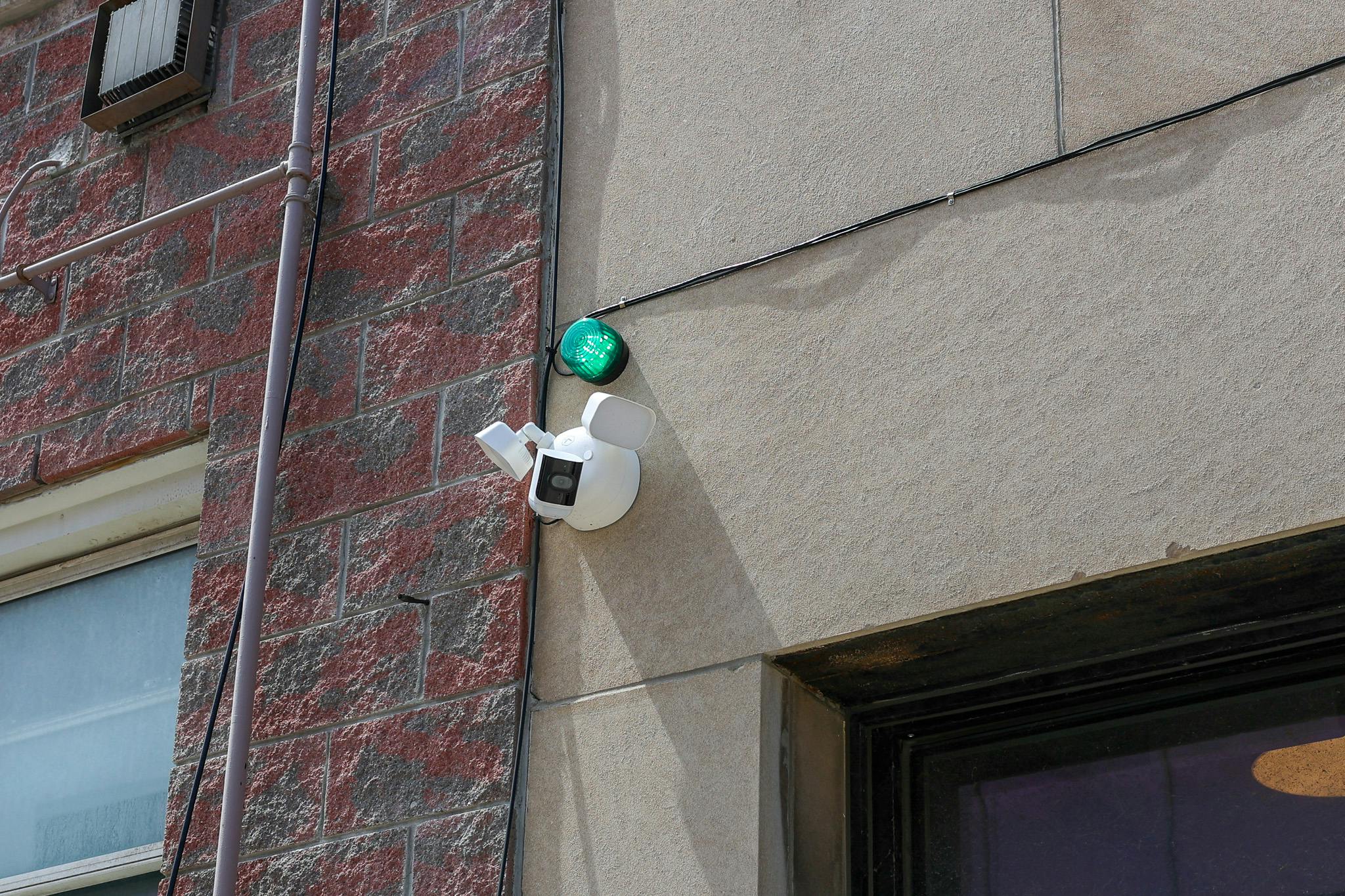 Project Greenlight cameras installed on side of building on Pelissier