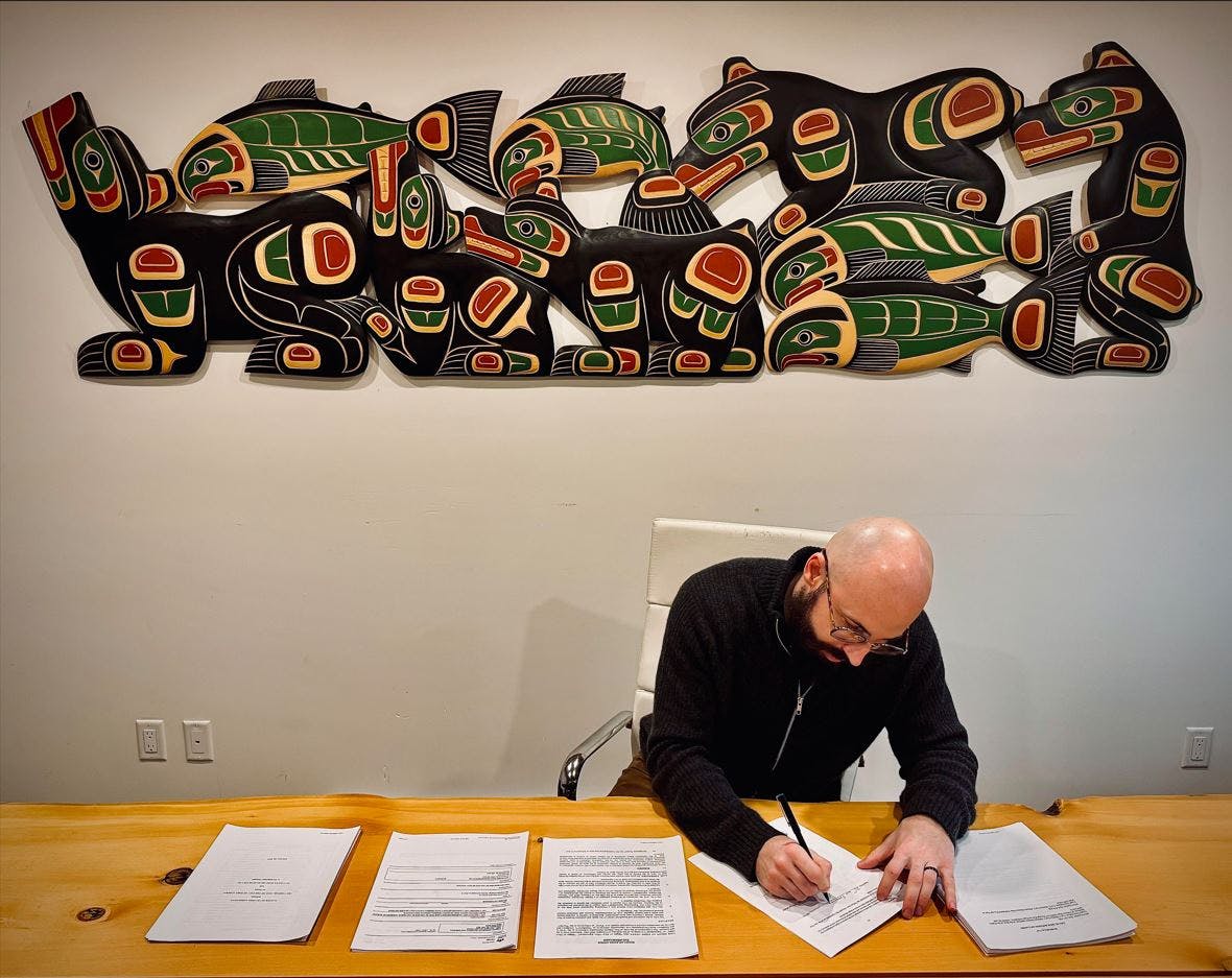 Matthews West - John Signing Agreement.JPG