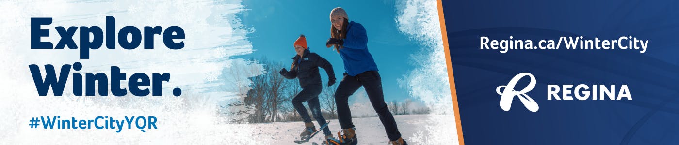 Explore Winter. Photo of two people enjoying winter activities with snow on the ground and trees in the background.