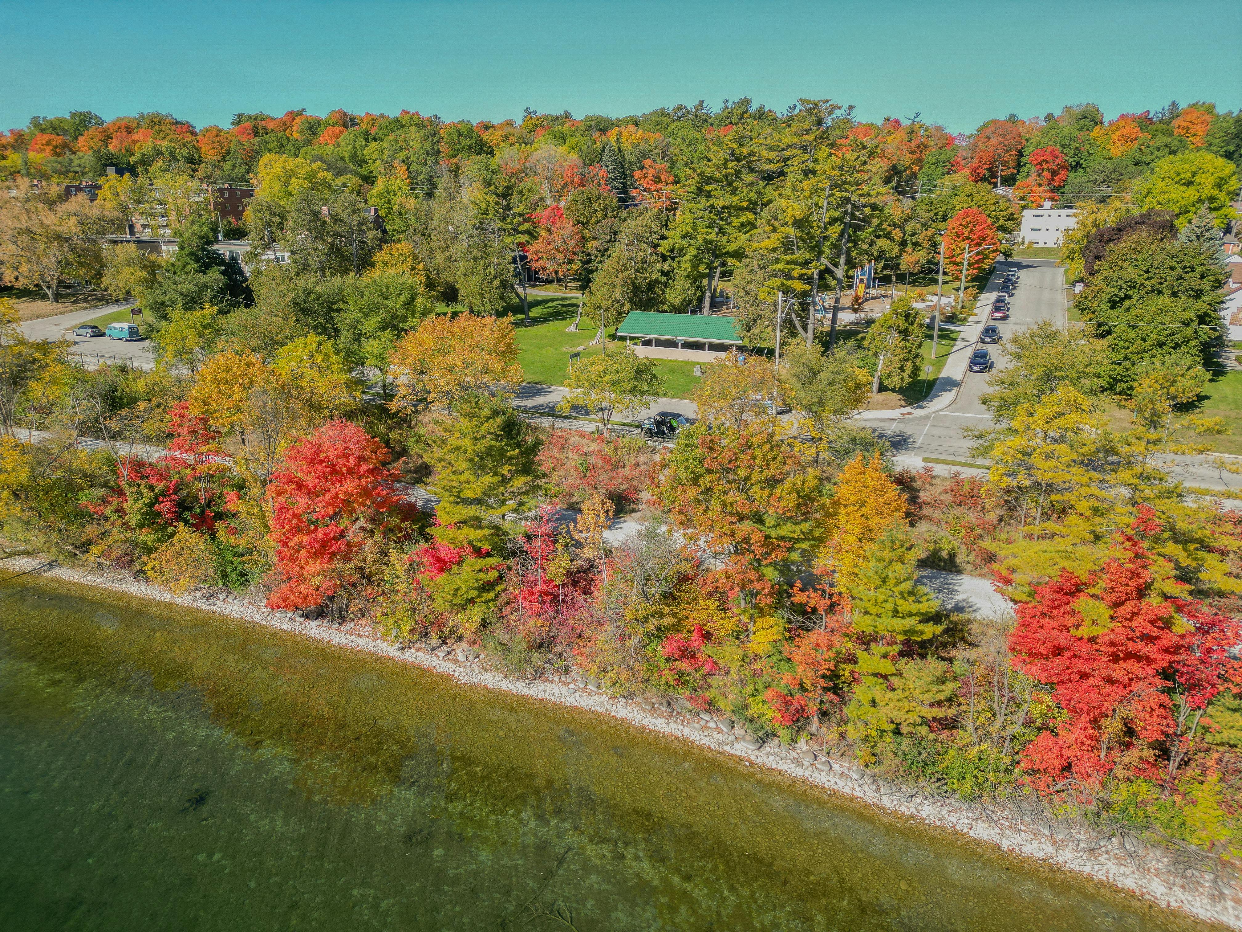 Bird's eye view of the shoreline and North Shore Trail, with St. Vincent Park in the background.