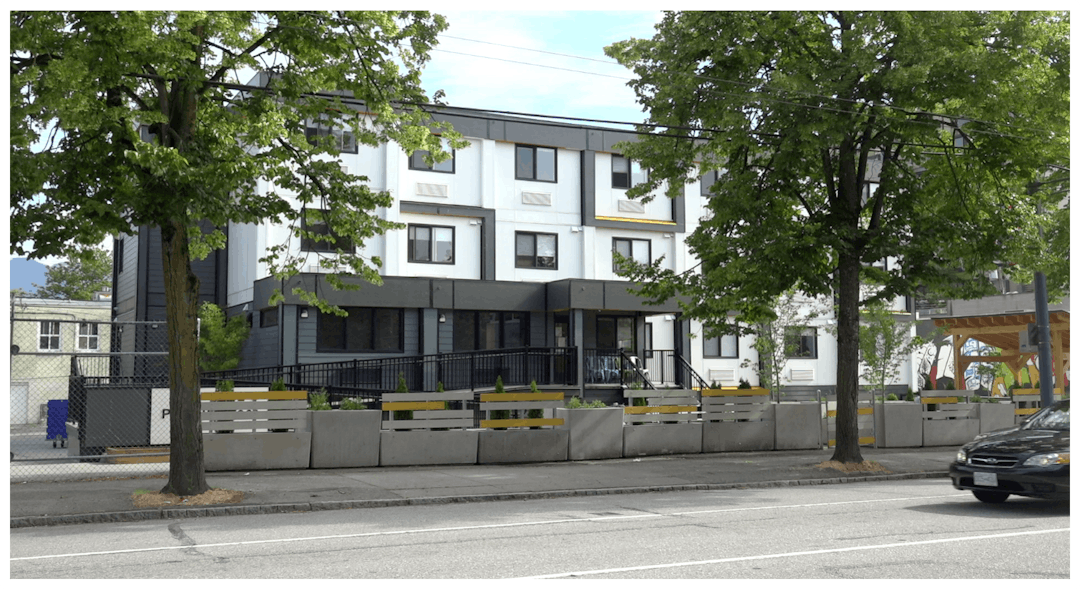 A Modular housing unit in Vancouver featuring compact, prefabricated structures arranged in a clean, modern layout.