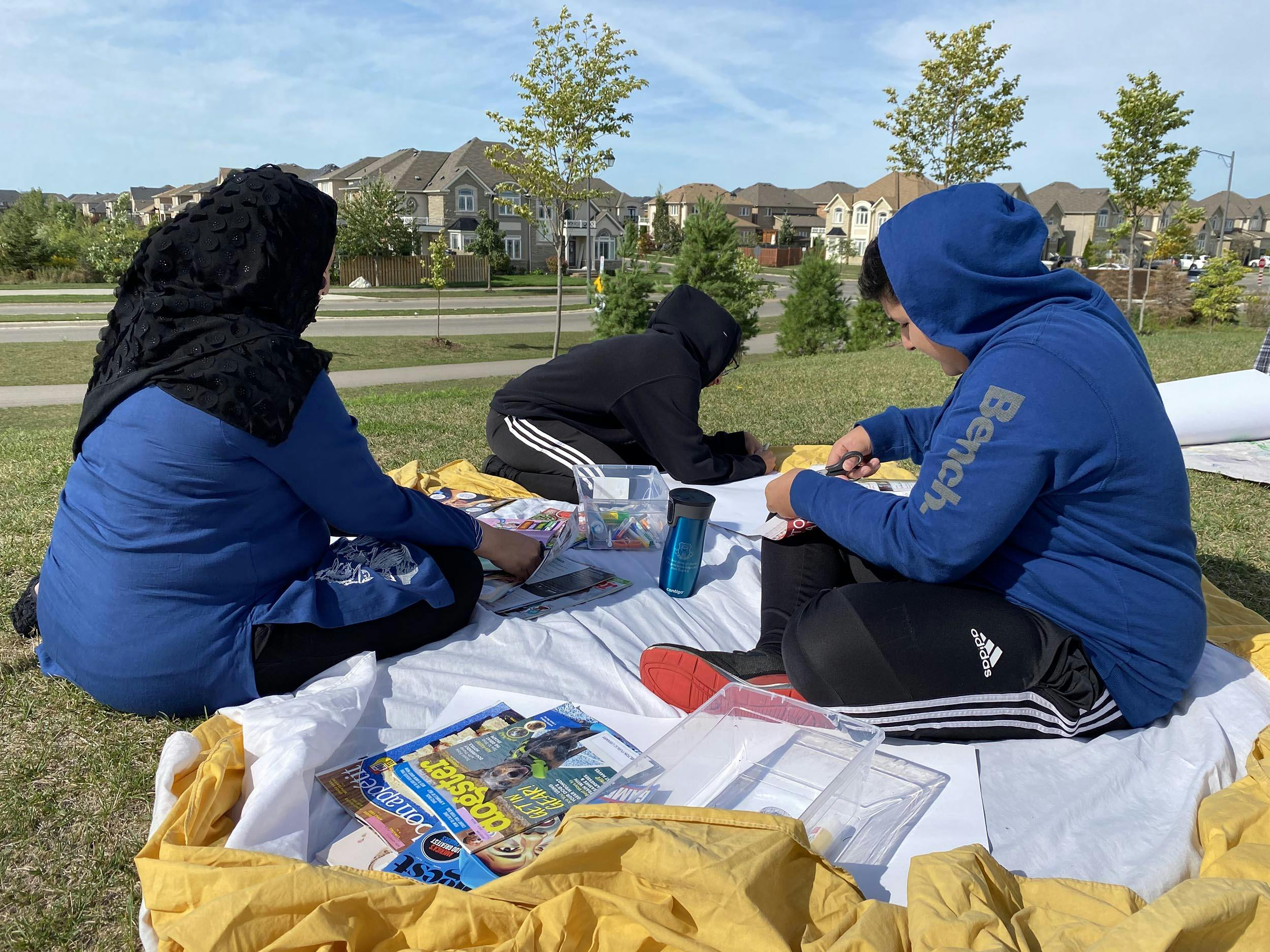 Family looking through magazines.