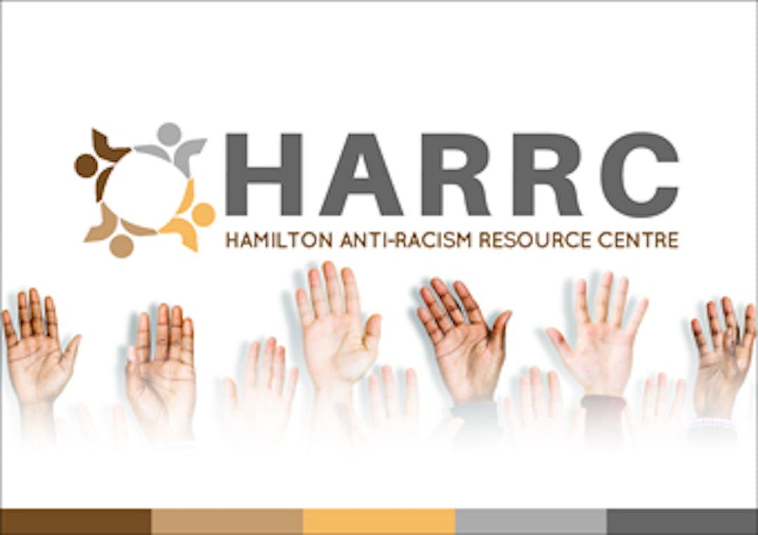 HARRC Logo over raised hands