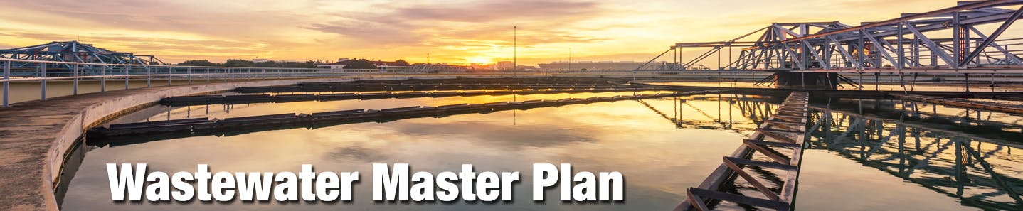 An image of a clarifier tank at a water treatment centre during sunset. The words 'Wastewater Master Plan' are on the screen as well.