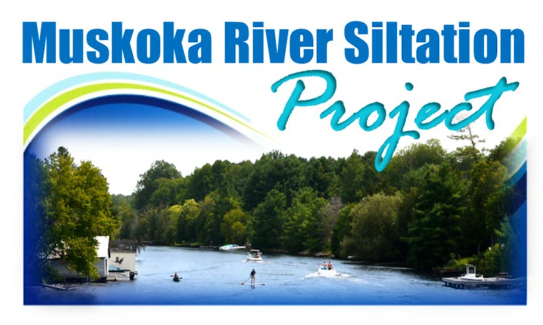 View of the Muskoka River with paddle boarding and boating activities on the water.