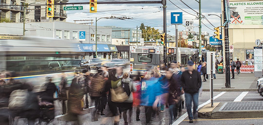 Image of people cross the street near Broadway-City Hall Station.