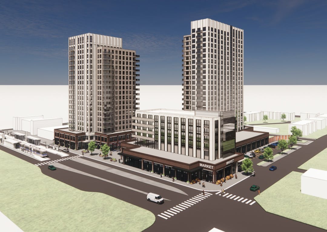 A colour rendering of the proposed project site from a bids eye view, with three connected buildings: two mid-rise towers on the left and right background, and a low rise building in the centre foreground, with a roadway intersection in front of the site.
