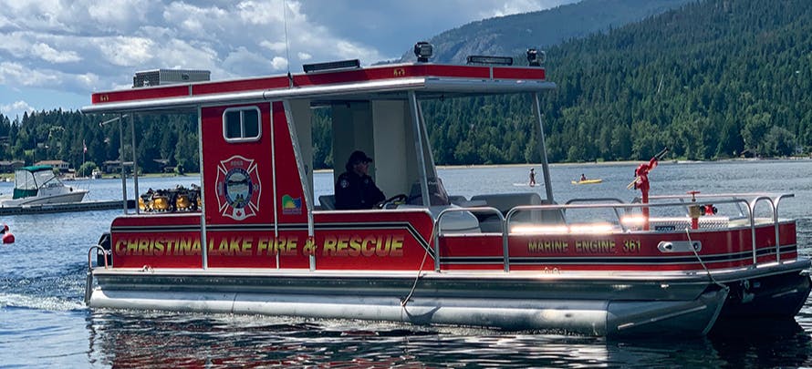 Christina Lake Fireboat leaves its mooring at the marina.