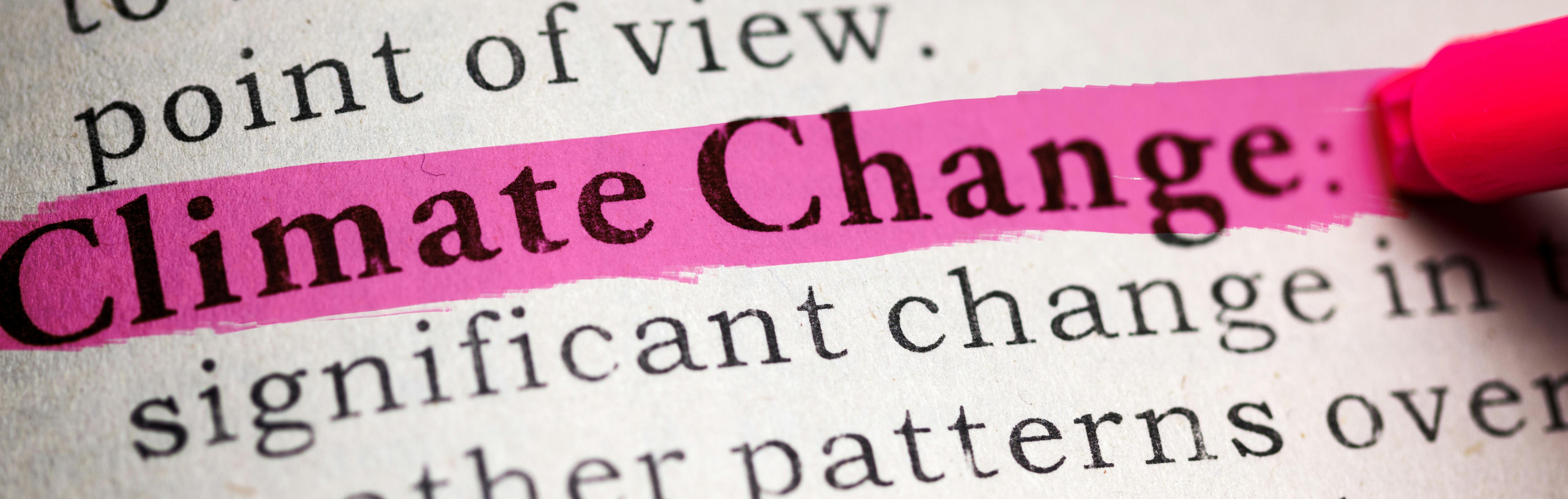 pink highlight of climate change definition in dictionary