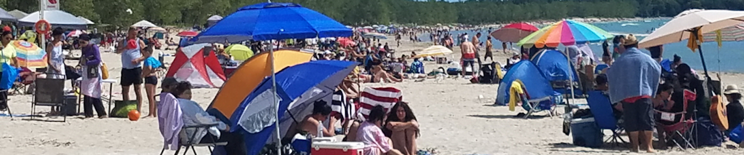 Image of a crowded beach at Sandbanks Provincial Park