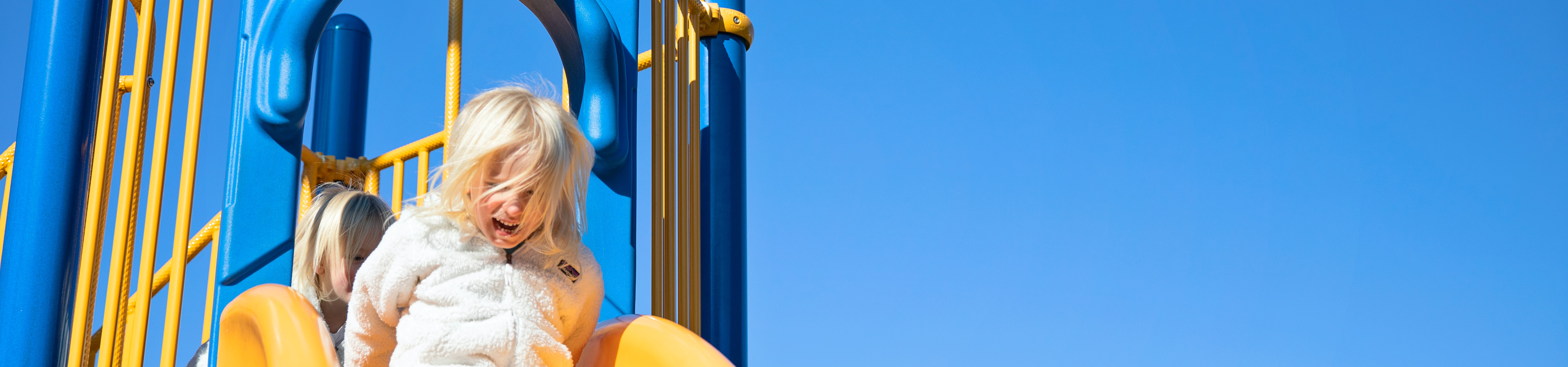 Child on a playground slide