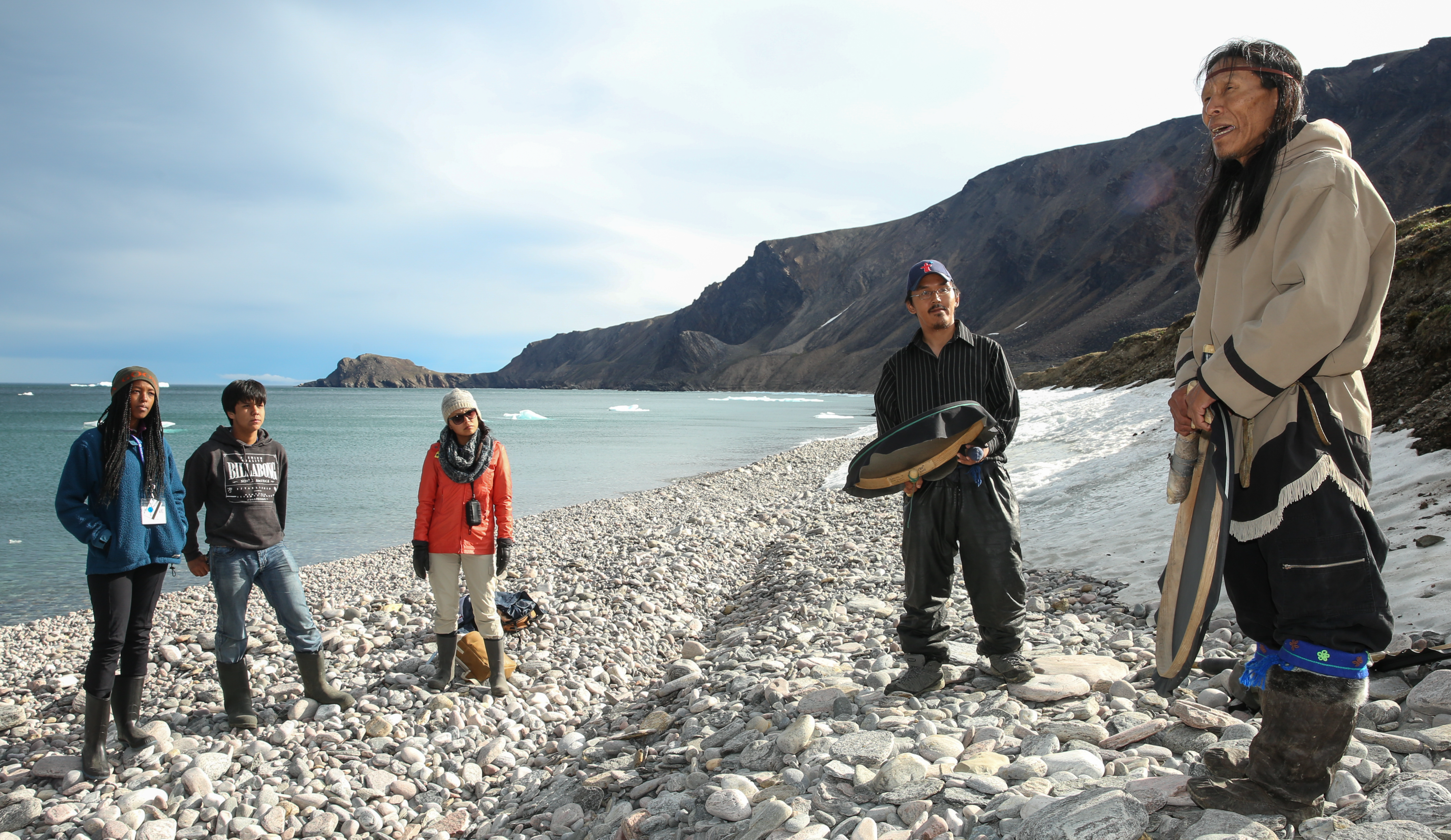 Two Inuit drummers share stories with visitors along the shore of Tallurutiup Imanga National Marine Conservation Area