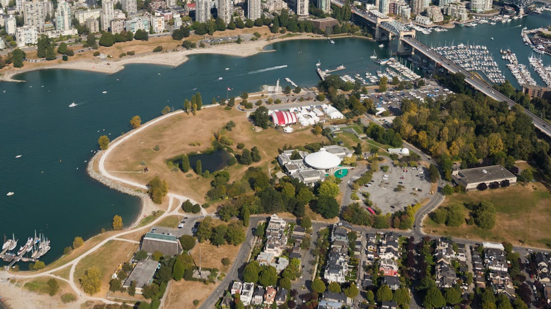 Aerial photograph of Kits Point facing east, with a view of Vanier Park, False Creek, the Burrard Bridge and downtown.