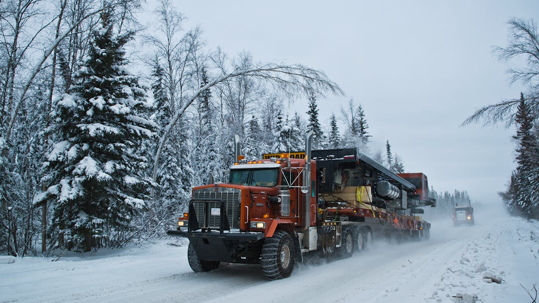 Commercial trucks carry big loads along the NWT's Mackenzie Valley Winter Road