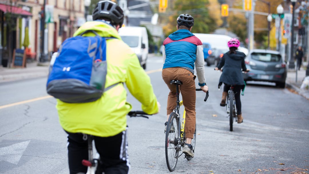 Three cyclists on Hunter Street