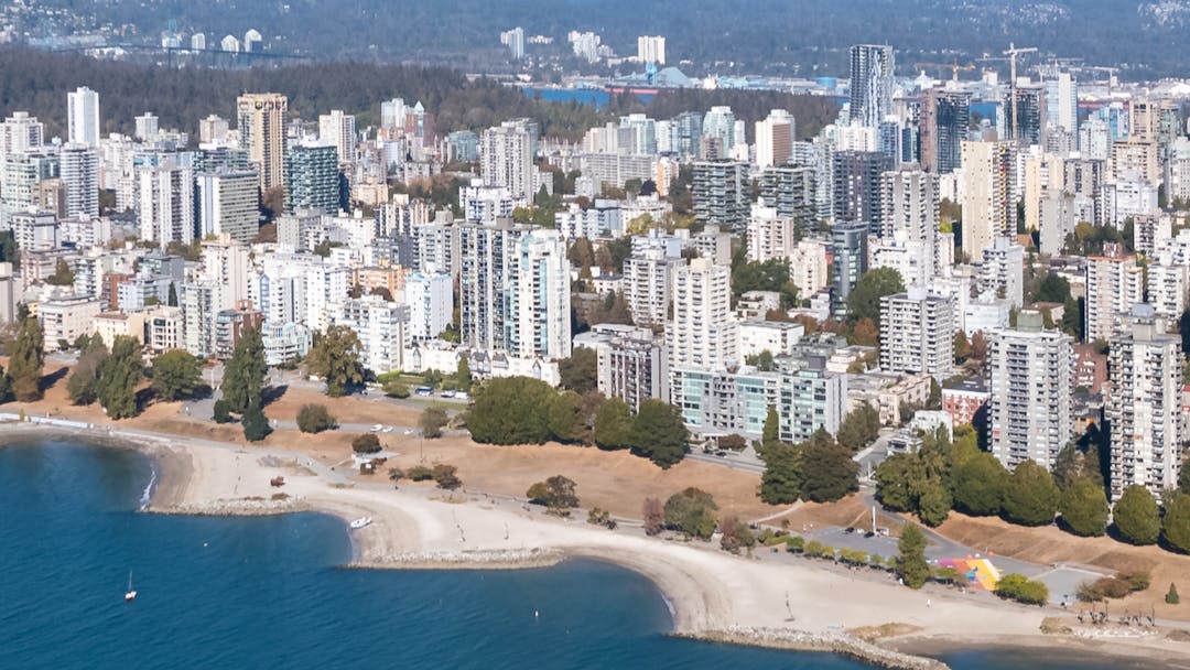 An aerial of the West End Waterfront site showing the Burrard bridge, parks, beach area and surrounding neighbourhood.