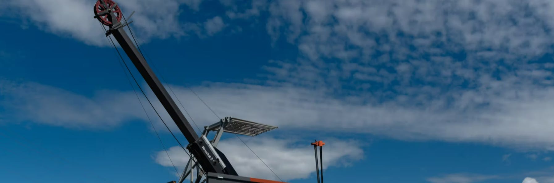 Drilling machine on a blue sky