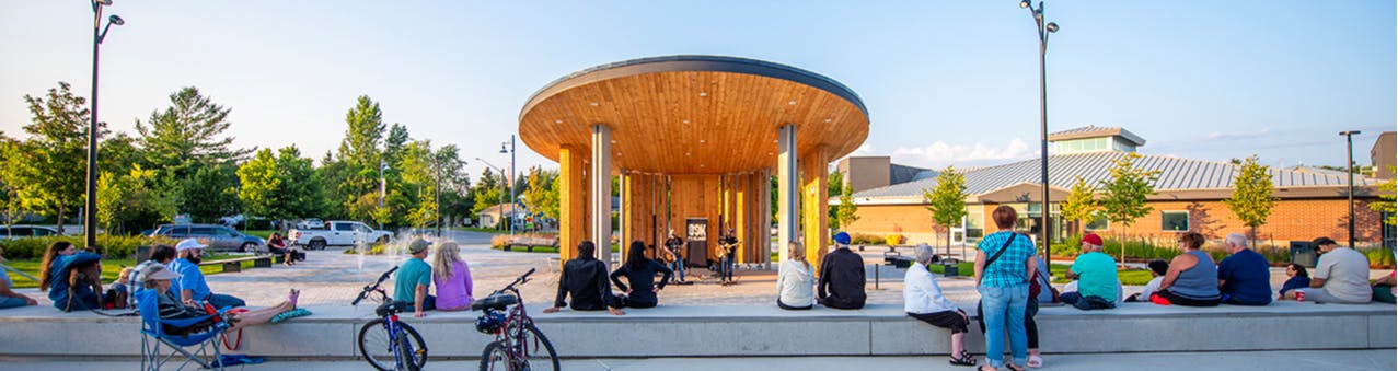 Crowd watching musicians play outdoors