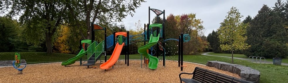 Playground structure and tennis courts at D'Hillier Park