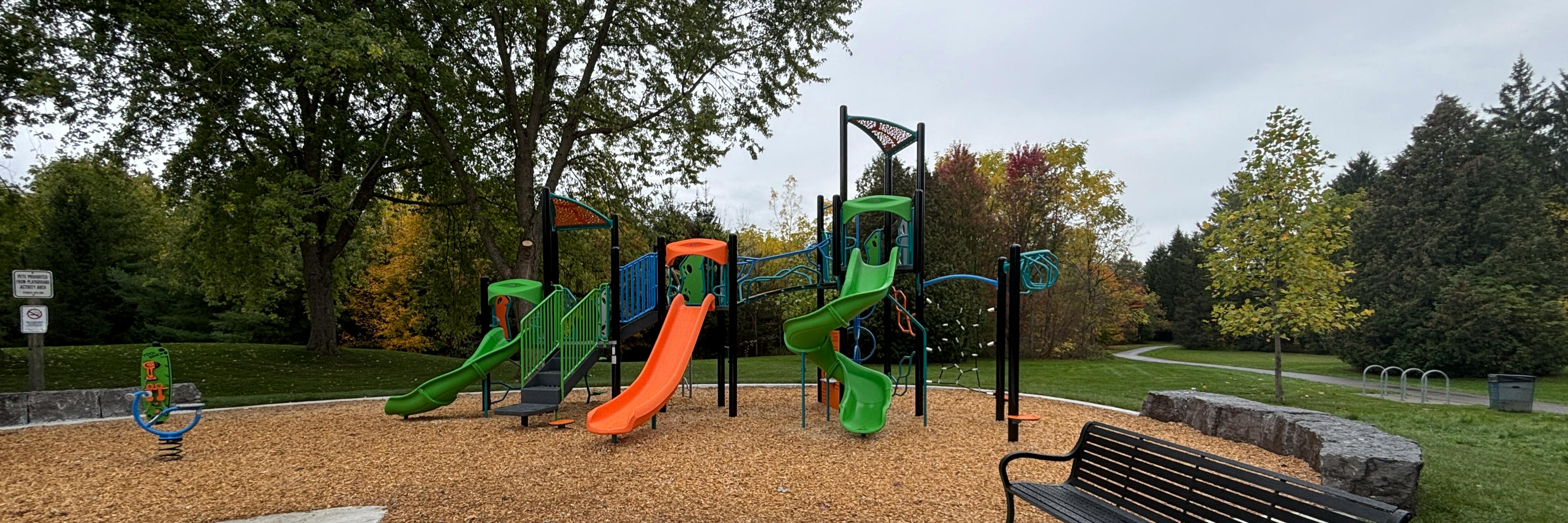 Playground structure and tennis courts at D'Hillier Park