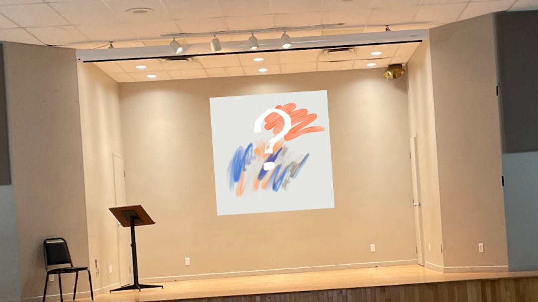 Empty community hall with fake painting with an interrogation mark.