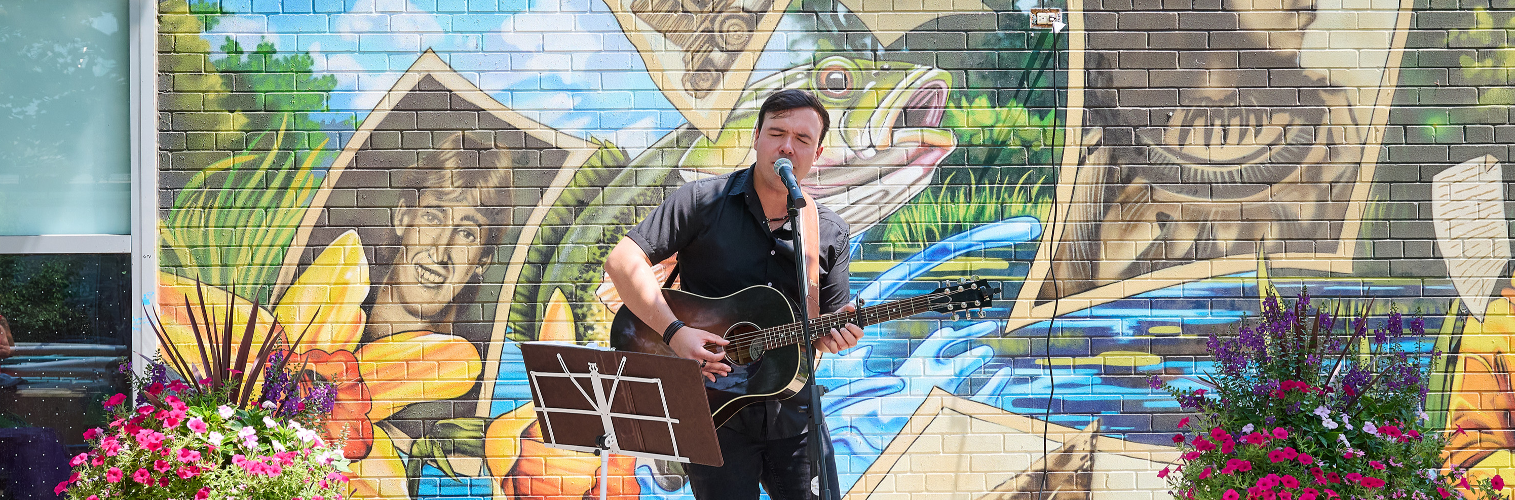 A musician performing on the Parkette Stage