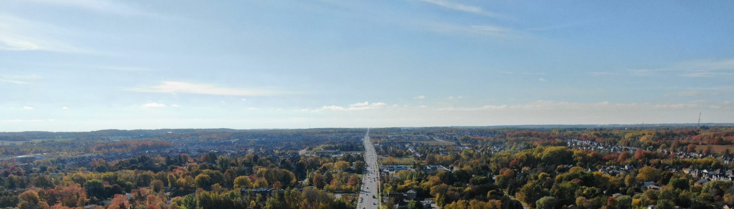 Trucks repaving rural road