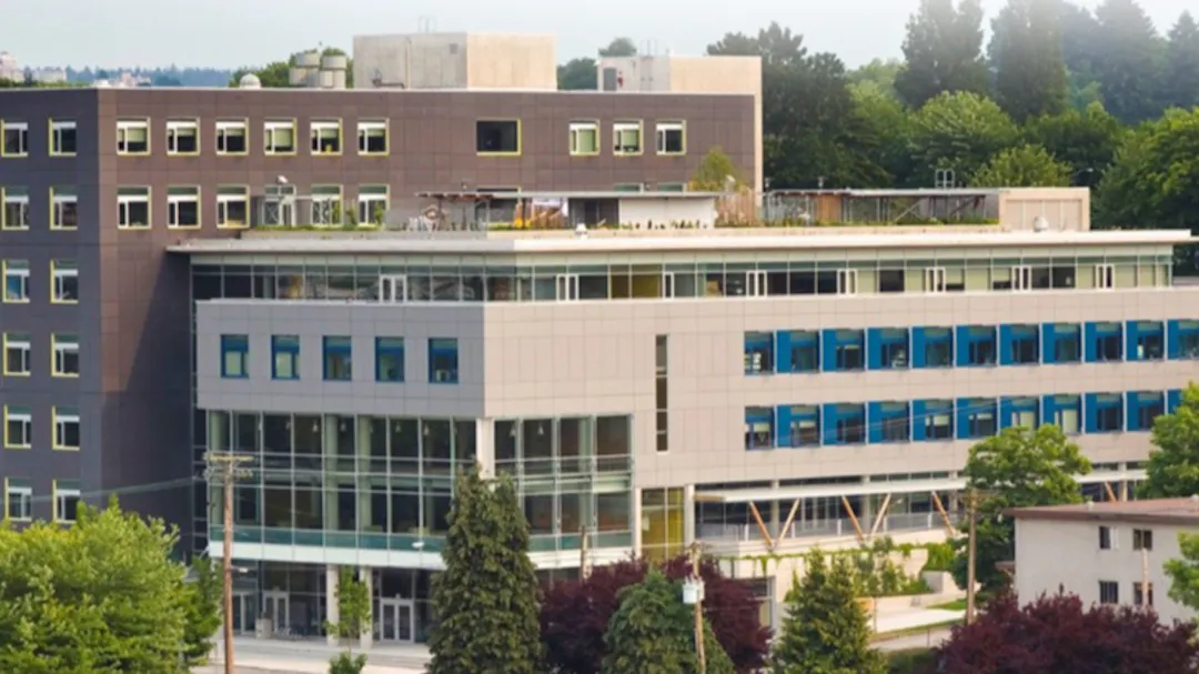 Vancouver Community College Building B with China Creek Park North in the foreground and residential buildings.